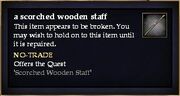 A scorched wooden staff