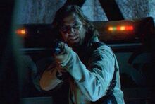 Desmond Hume with an AK-47