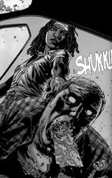 Michonne acabando con un caminante para salvar a Carl.
