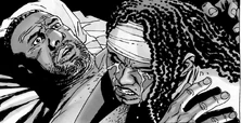 Michonne llorando en los brazos de Tyreese