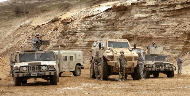 File:9x01 Convoy Soldiers.jpg