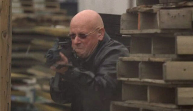 File:7x24- bald Alan Wilson mercenary.jpg