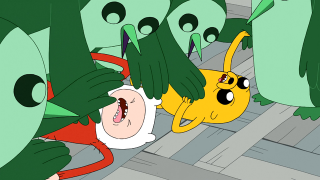 File:S4e24 penguins tackling Finn and Jake.png