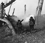 American soldiers advancing on a bunker
