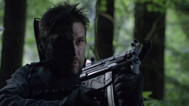 File:Slade Wilson with a half-covered face.png