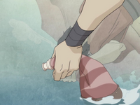 Wan replenishes a water skin