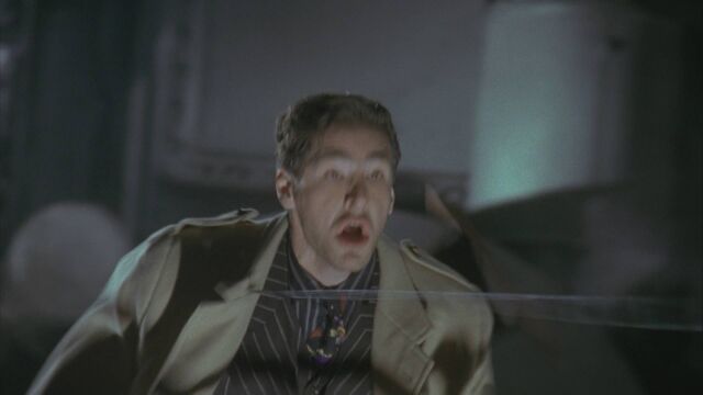 File:Batman 1989 - Batman Drags the Hood .jpg
