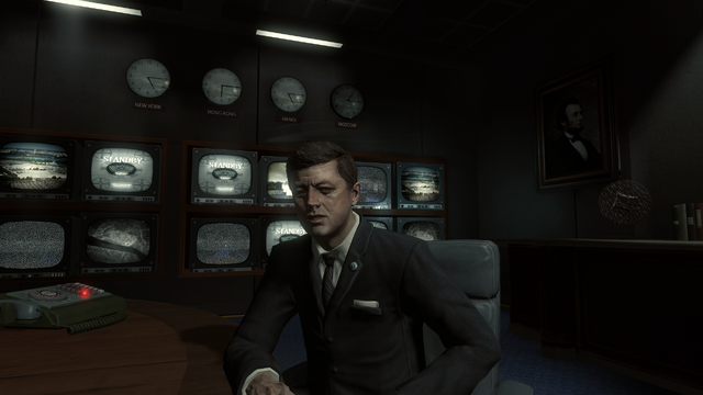 File:John Kennedy at table.png