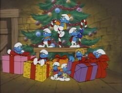 Smurfs in front of a Christmas tree