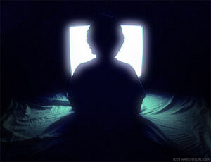 Child-watching-television-silhouette