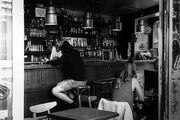 Bartender speaking with a client, Paris