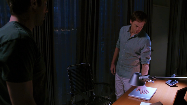 File:Dexter at his desk.png