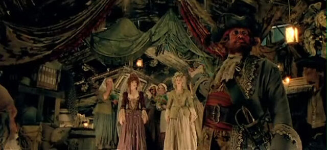 File:AuctioneerPresentingWenches.jpg