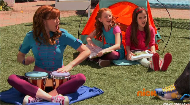 File:Marina playing her bongos.jpg