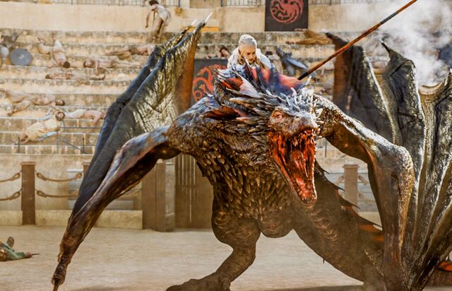 File:Dany climbs on drogon.jpg