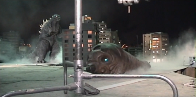 File:TokyoGoji versus TokyoMosuLarva.png