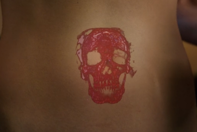 File:302-Skull on Adalind's stomach.png