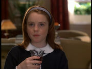 Hallie trying the wine