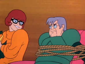 Professor Greer unmasked
