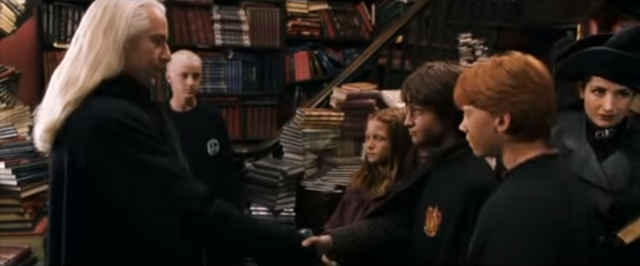 File:1992 Quidditch spectator beside Irma Pince.png