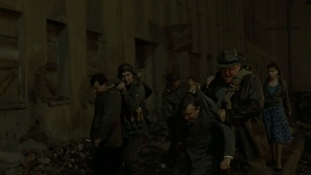 File:People dragged by the collars.jpg