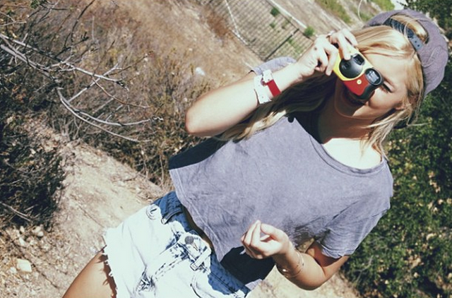 File:Olivia with a Camera.png