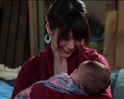 Nanaha holding her son