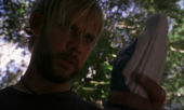 2X12 - CharlieHoldingStatue.jpg