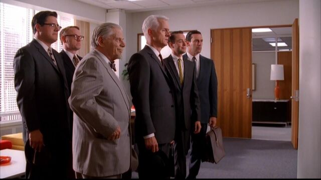 File:Blowing smoke partners wait.jpg