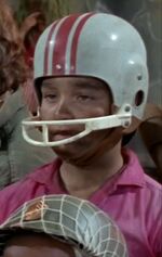 Only boy in football helmet