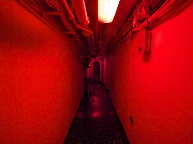 File:And-navigating-my-way-to-bed-in-the-dim-red-light-that-bathes-the-inside-of-the-wasp-at-night--the-red-keeps-the-vessel-from-being-seen-by-the-enemy-and-maintains-sailors-night-vision.jpg