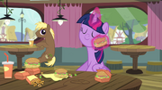 Twilight wiping her face with a hay burger S4E15.png