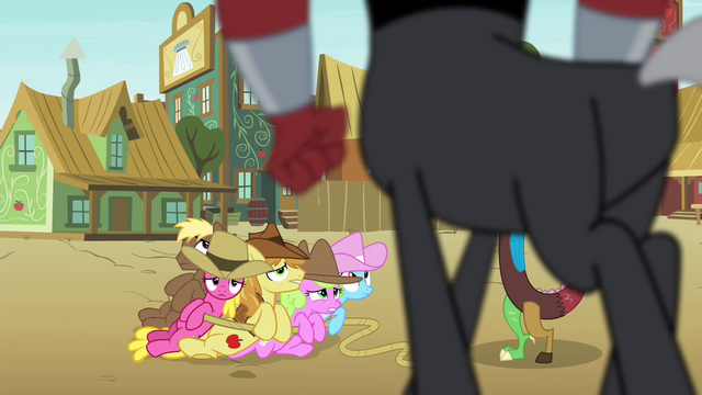 File:Tirek stands over the Earth ponies S4E25.png