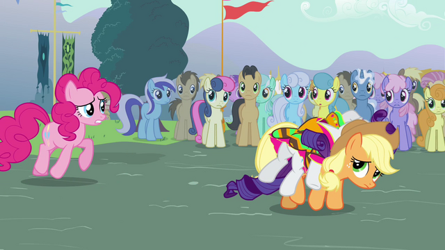 File:Applejack carrying a fainted Rarity S3E05.png