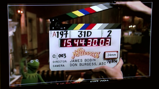 File:Scratching the Surface clapper.png