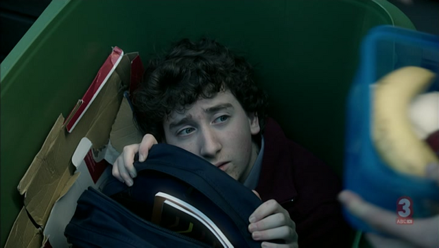 File:Mike hiding in bin.png