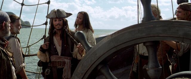 File:CotBPJackbeforelovinglytouchesBlackPearlWheel.jpg