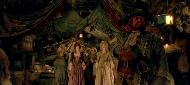 File:AuctioneerPresentingWenches.jpg