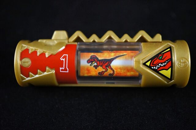File:PRDC Gold T-Rex Charger.jpg