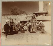 Samarkand A group of musicians playing for a bacha dancing boy