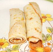 Roly-Poly Pancake with filling, cut in half to illustrate rolling