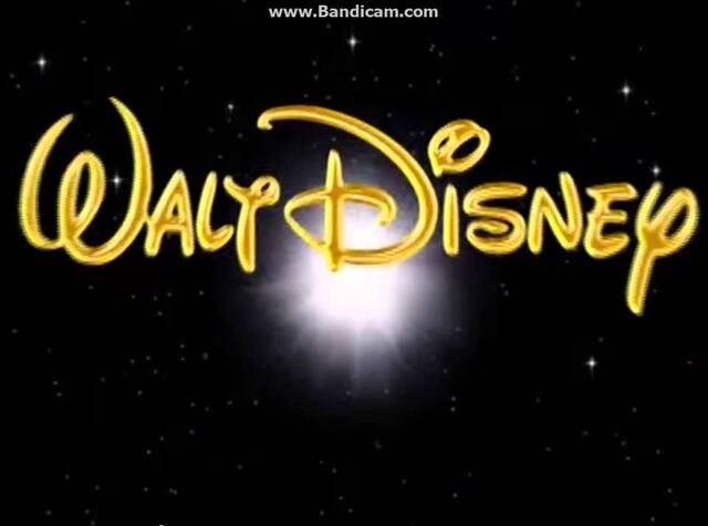 File:Walt Disney in gold on a black background.jpg