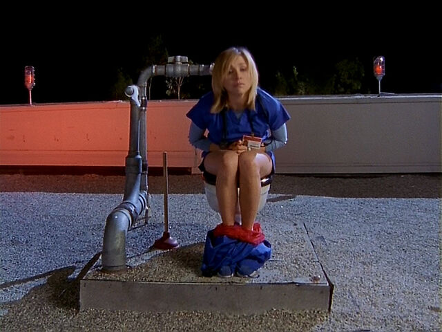 File:3x13 Elliot on toilet.jpg