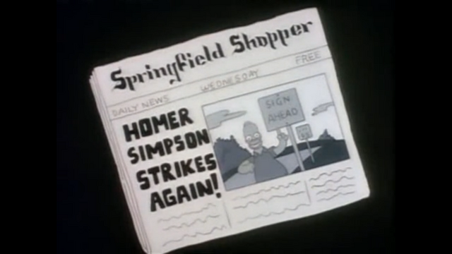 File:HomerNewspaperSign.png