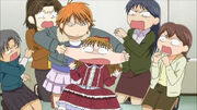Kyoko pinches Maria's cheecks