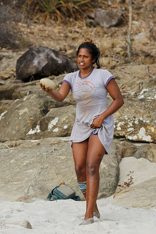 File:Nataliethrowingrockorfruitonbeach.jpg