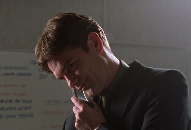 File:Robbie calls his bank in Skin Deep.jpg