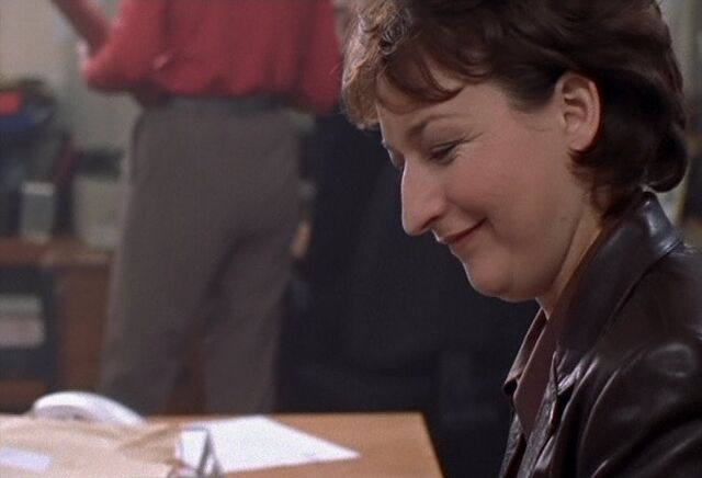 File:Jackie chuckles at Mike's reply to Robbie at the beginning of Skin Deep.jpg