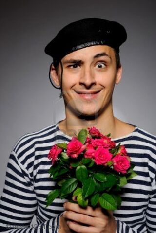 File:7887006-funny-emotional-romantic-sailor-man-holding-rose-flowers-prepared-for-a-date.jpg