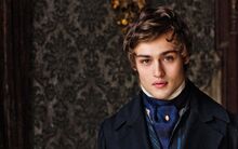 Douglas-Booth-Romeo-And-Juliet-Hairstyle-2015-915x572